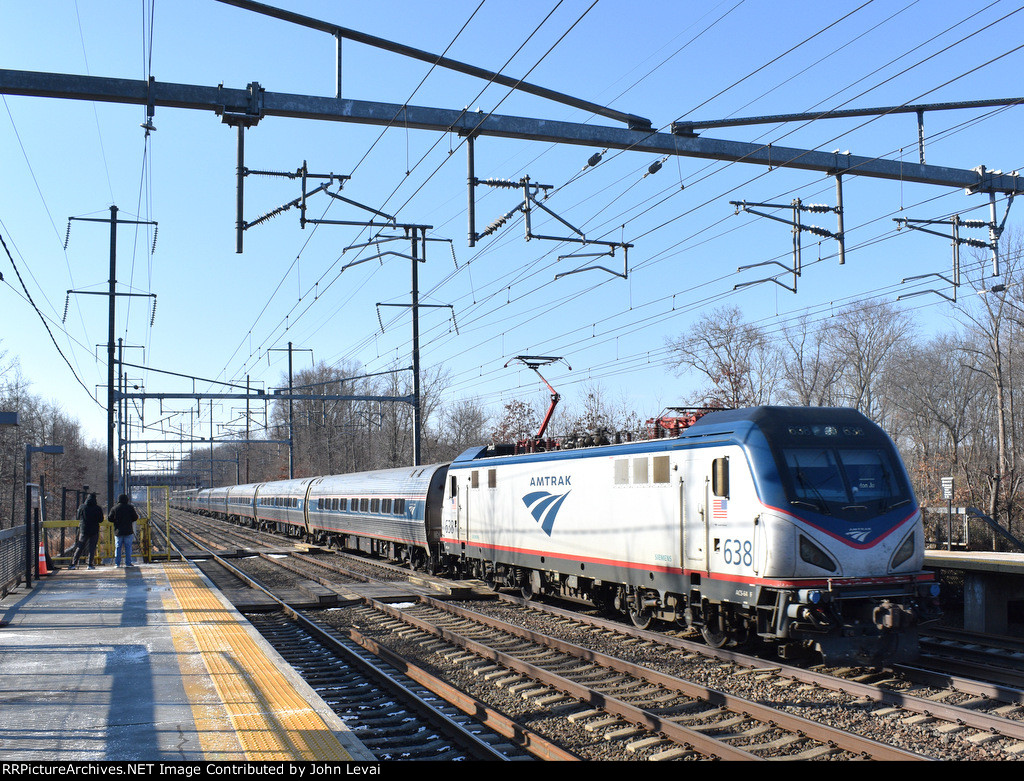 Amtrak Silver Meteor Train # 98 racing past PJC with ACS-64 # 638 in the lead as two other railfans do their thing. 